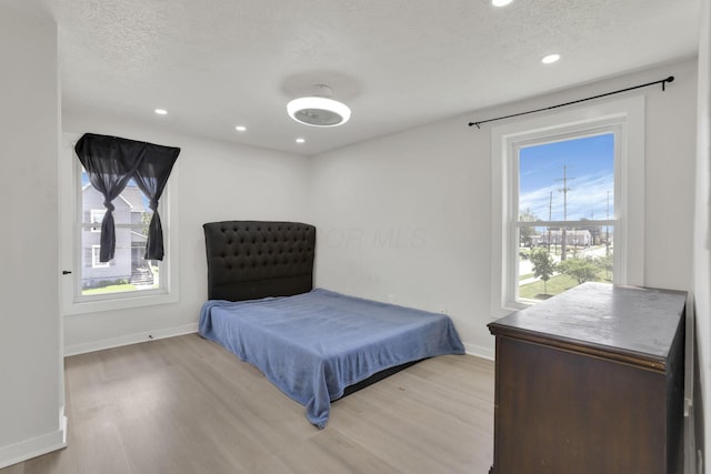 841 Saint Clair Ave, Columbus, OH 43201 - bedroom with light wood finished floors, baseboards, a textured ceiling, and recessed lighting