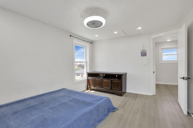 841 Saint Clair Ave, Columbus, OH 43201 - bedroom featuring light wood-style floors, baseboards, recessed lighting, and attic access