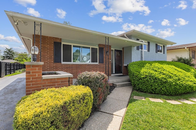 270 S Kellner Rd, Columbus, OH 43209 - view of front of home featuring brick siding, fence, and covered porch