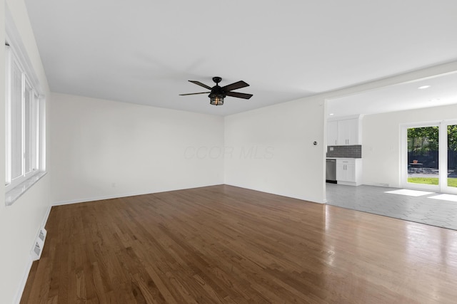 270 S Kellner Rd, Columbus, OH 43209 - unfurnished living room with dark wood finished floors, a ceiling fan, and baseboards