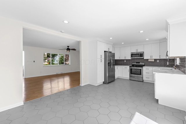 270 S Kellner Rd, Columbus, OH 43209 - kitchen with appliances with stainless steel finishes, open floor plan, a sink, a ceiling fan, and recessed lighting