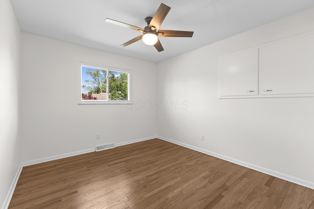 270 S Kellner Rd, Columbus, OH 43209 - empty room with wood finished floors, baseboards, and ceiling fan