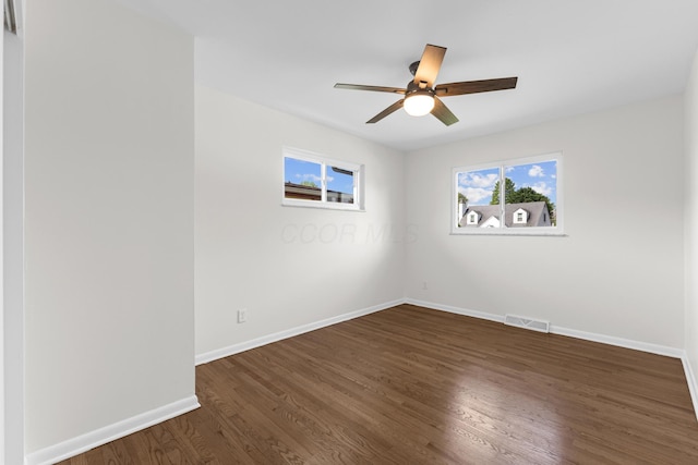 270 S Kellner Rd, Columbus, OH 43209 - spare room featuring dark wood-style flooring, plenty of natural light, baseboards, and a ceiling fan