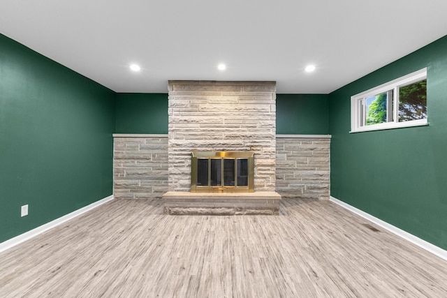 270 S Kellner Rd, Columbus, OH 43209 - unfurnished living room featuring a stone fireplace, wood finished floors, baseboards, and recessed lighting
