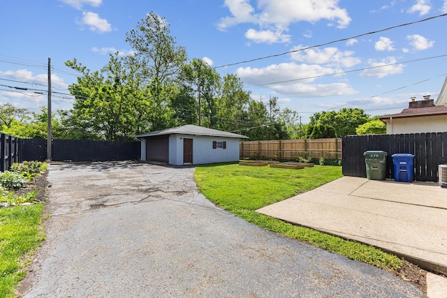 270 S Kellner Rd, Columbus, OH 43209 - view of yard with an outbuilding, a detached garage, and asphalt driveway