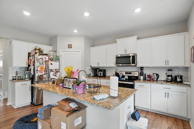 314 Sandburg Dr, Lithopolis, OH 43136 - kitchen featuring appliances with stainless steel finishes, backsplash, white cabinets, and recessed lighting