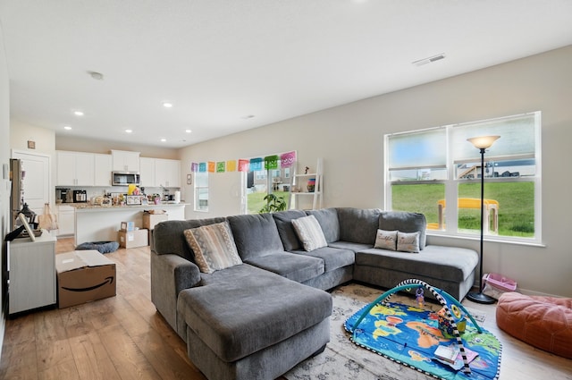 314 Sandburg Dr, Lithopolis, OH 43136 - living area featuring light wood-type flooring and recessed lighting