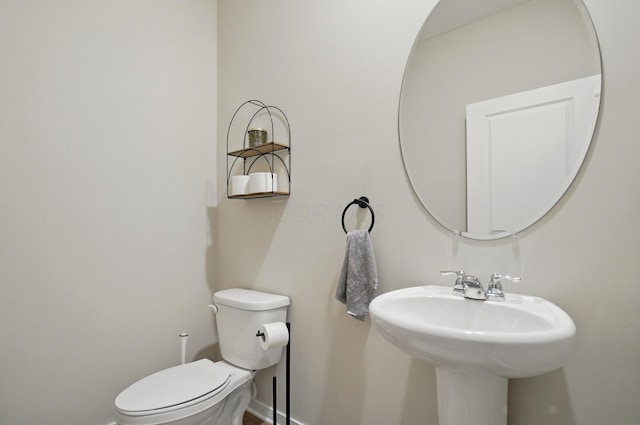 314 Sandburg Dr, Lithopolis, OH 43136 - bathroom featuring toilet, baseboards, and a sink