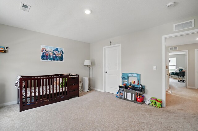 314 Sandburg Dr, Lithopolis, OH 43136 - bedroom with carpet, baseboards, and a nursery area