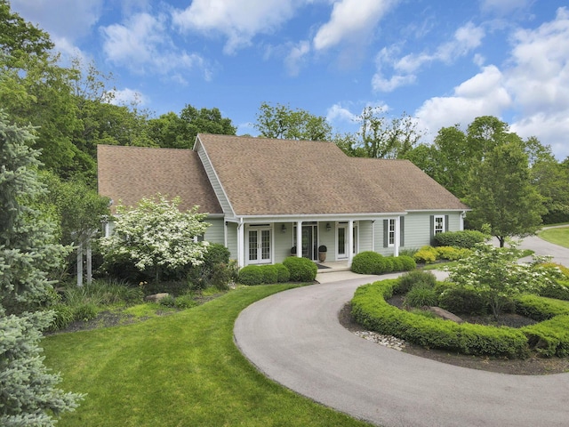 1200 Willow Rd, Springfield, OH 45502 - cape cod home with french doors, a front yard, and a shingled roof