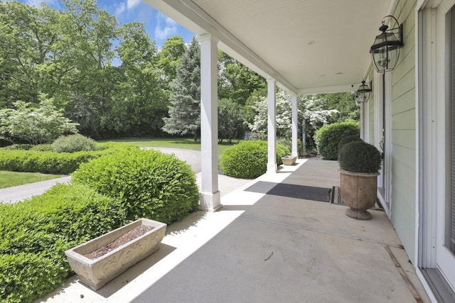 1200 Willow Rd, Springfield, OH 45502 - covered porch featuring view of wooded area