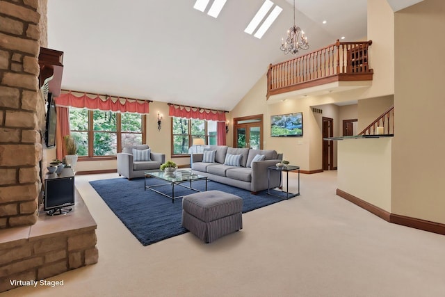 1200 Willow Rd, Springfield, OH 45502 - carpeted living area featuring baseboards, high vaulted ceiling, a chandelier, and stairway