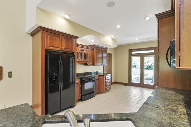 1200 Willow Rd, Springfield, OH 45502 - kitchen featuring black appliances, light tile patterned floors, a sink, recessed lighting, and brown cabinetry