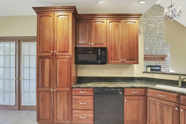 1200 Willow Rd, Springfield, OH 45502 - kitchen featuring black appliances, a sink, a chandelier, light tile patterned floors, and a fireplace
