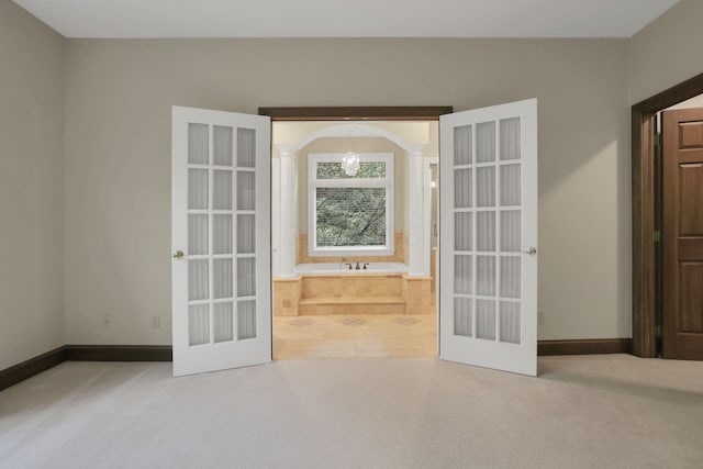 1200 Willow Rd, Springfield, OH 45502 - empty room with french doors, carpet, and baseboards
