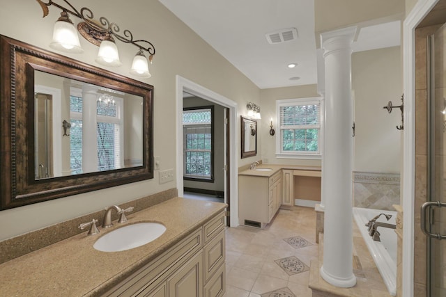 1200 Willow Rd, Springfield, OH 45502 - full bath featuring decorative columns, two vanities, a bath, tile patterned floors, and a shower stall