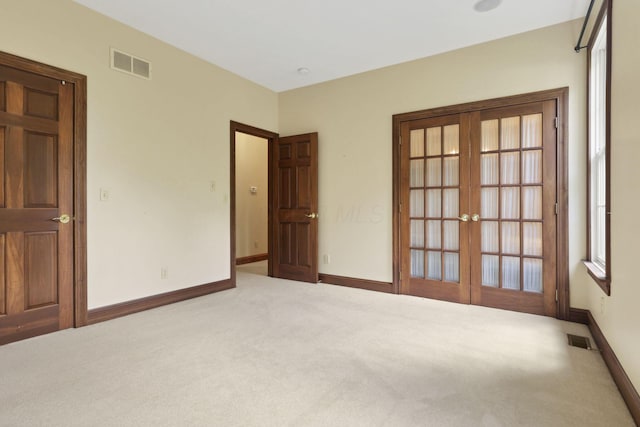 1200 Willow Rd, Springfield, OH 45502 - carpeted spare room with baseboards and french doors