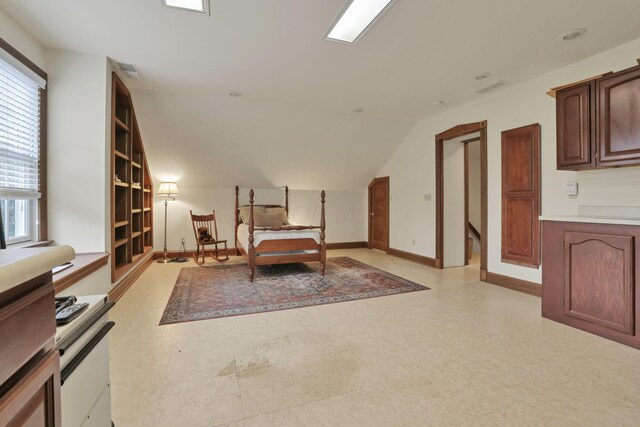 1200 Willow Rd, Springfield, OH 45502 - living area featuring light floors, plenty of natural light, baseboards, and vaulted ceiling