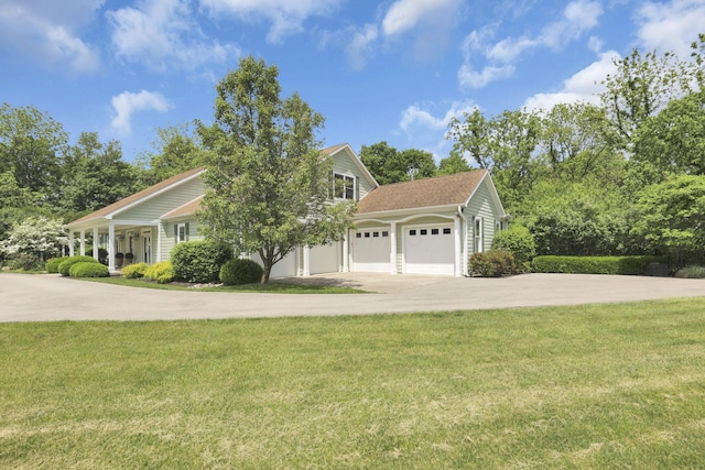 1200 Willow Rd, Springfield, OH 45502 - view of front of home with driveway, a front lawn, and an attached garage