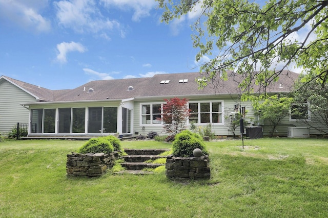 1200 Willow Rd, Springfield, OH 45502 - back of property featuring a sunroom and a lawn
