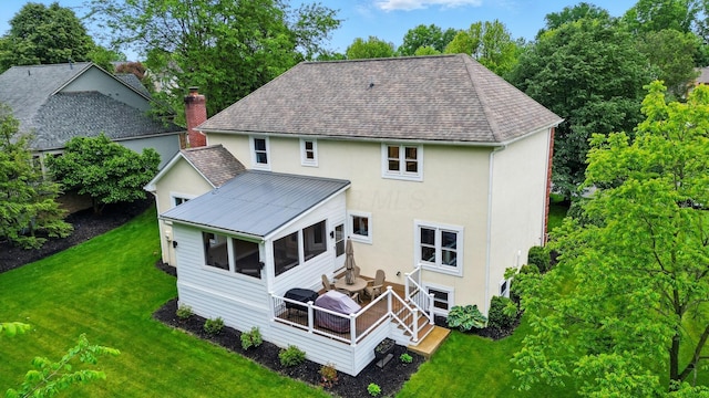 5741 Ridgewood Ave, Westerville, OH 43082 - rear view of property with stucco siding, a wooden deck, a lawn, a sunroom, and a shingled roof