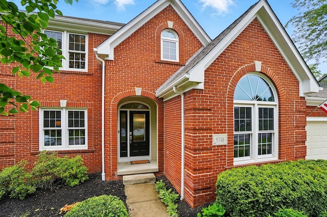 5741 Ridgewood Ave, Westerville, OH 43082 - traditional-style home featuring brick siding and a garage