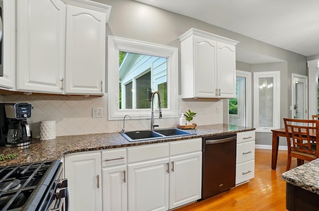 5741 Ridgewood Ave, Westerville, OH 43082 - kitchen with appliances with stainless steel finishes, a sink, decorative backsplash, and healthy amount of natural light
