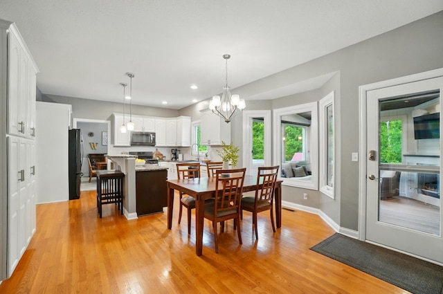 5741 Ridgewood Ave, Westerville, OH 43082 - dining room featuring plenty of natural light, a chandelier, light wood finished floors, and recessed lighting
