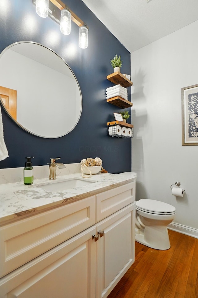 5741 Ridgewood Ave, Westerville, OH 43082 - bathroom with wood finished floors, vanity, and toilet