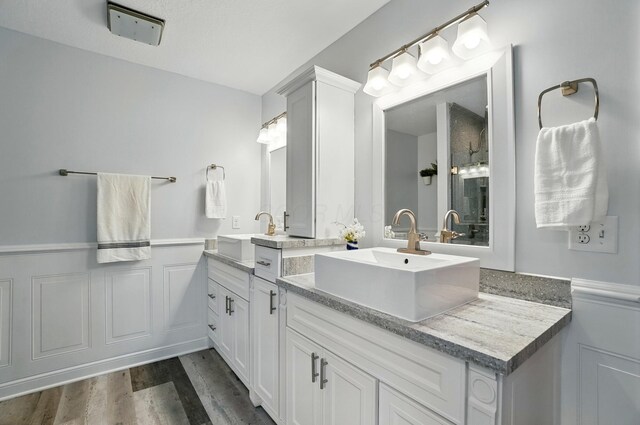 5741 Ridgewood Ave, Westerville, OH 43082 - full bathroom featuring vanity, wainscoting, and wood finished floors
