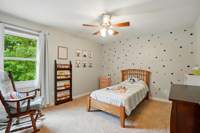 5741 Ridgewood Ave, Westerville, OH 43082 - bedroom with light carpet, baseboards, and a ceiling fan