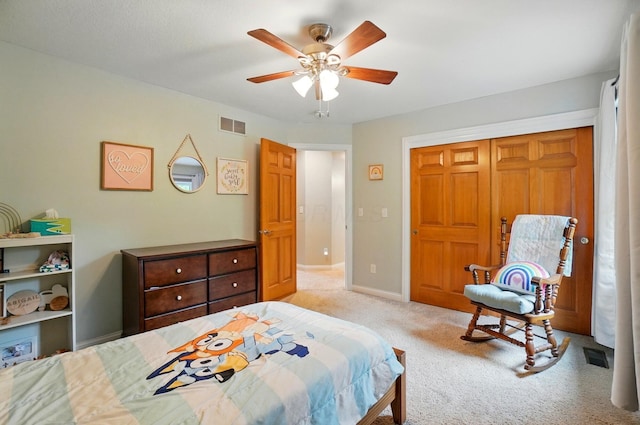 5741 Ridgewood Ave, Westerville, OH 43082 - bedroom featuring light colored carpet, baseboards, ceiling fan, and a closet