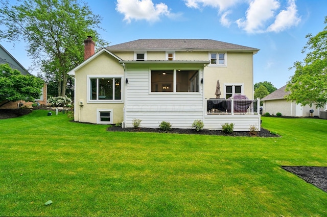 5741 Ridgewood Ave, Westerville, OH 43082 - rear view of property featuring a chimney, a lawn, and stucco siding