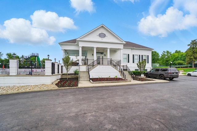 5741 Ridgewood Ave, Westerville, OH 43082 - neoclassical home with stairway, covered porch, and roof with shingles