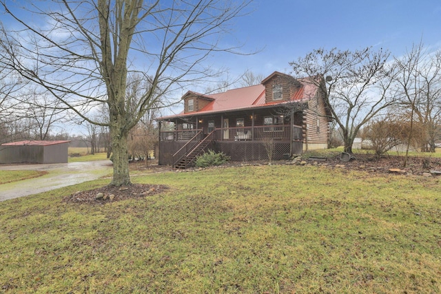 7760 Township Rd 177, Fredericktown, OH 43019 - view of front facade featuring covered porch, a front lawn, stairs, log siding, and metal roof