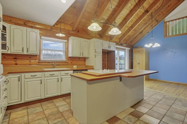 7760 Township Rd 177, Fredericktown, OH 43019 - kitchen with a sink, light countertops, a kitchen island with sink, pendant lighting, and wood ceiling