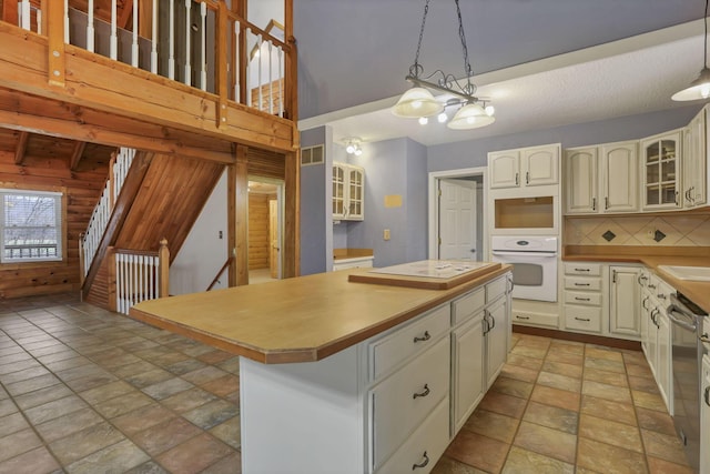 7760 Township Rd 177, Fredericktown, OH 43019 - kitchen featuring white oven, light stone finish flooring, a center island, stainless steel dishwasher, and glass insert cabinets