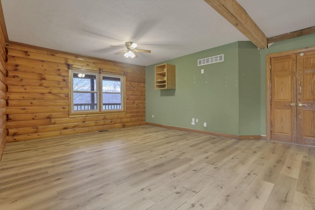 7760 Township Rd 177, Fredericktown, OH 43019 - empty room with light wood finished floors, ceiling fan, a textured ceiling, baseboards, and beam ceiling