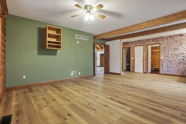 7760 Township Rd 177, Fredericktown, OH 43019 - unfurnished living room featuring a ceiling fan, light wood-style flooring, baseboards, and a textured ceiling
