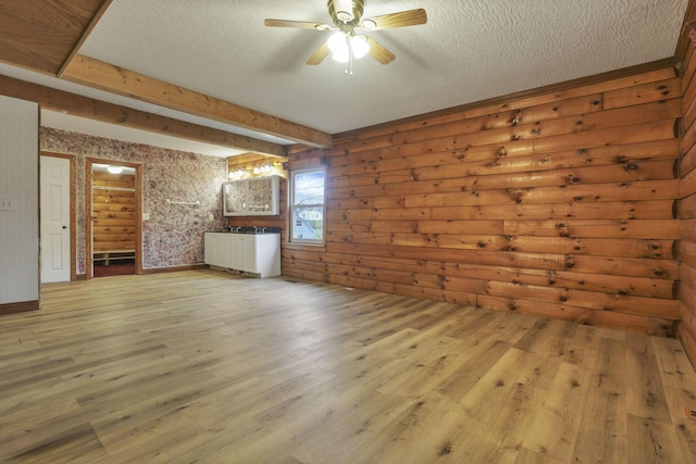 7760 Township Rd 177, Fredericktown, OH 43019 - unfurnished living room with a ceiling fan, light wood-style flooring, and a textured ceiling