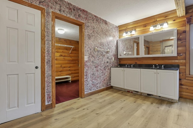 7760 Township Rd 177, Fredericktown, OH 43019 - full bathroom with wood finished floors, a textured ceiling, wallpapered walls, vanity, and baseboards