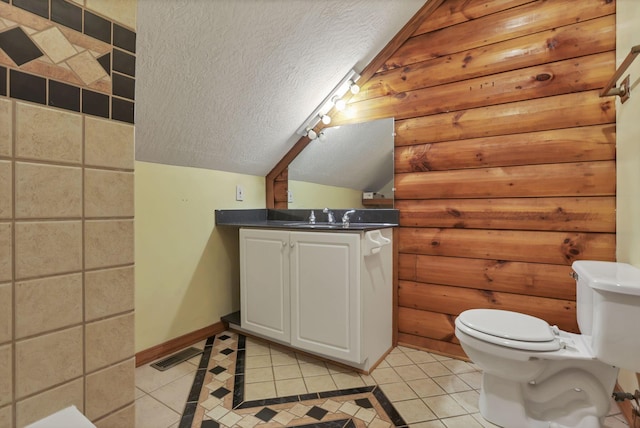 7760 Township Rd 177, Fredericktown, OH 43019 - bathroom with a textured ceiling, tile patterned floors, toilet, baseboards, and vanity