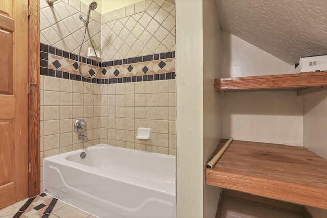 7760 Township Rd 177, Fredericktown, OH 43019 - bathroom with shower / bath combination, vaulted ceiling, tile patterned flooring, and a textured ceiling