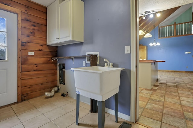 7760 Township Rd 177, Fredericktown, OH 43019 - laundry room featuring baseboards and a chandelier
