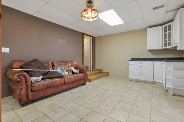 7760 Township Rd 177, Fredericktown, OH 43019 - living area featuring a drop ceiling and light tile patterned flooring