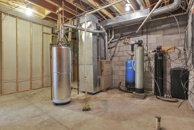 7760 Township Rd 177, Fredericktown, OH 43019 - unfinished below grade area featuring a water softener, heating unit, and water heater