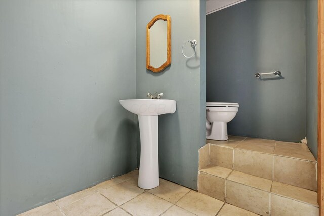7760 Township Rd 177, Fredericktown, OH 43019 - half bath featuring toilet and tile patterned floors