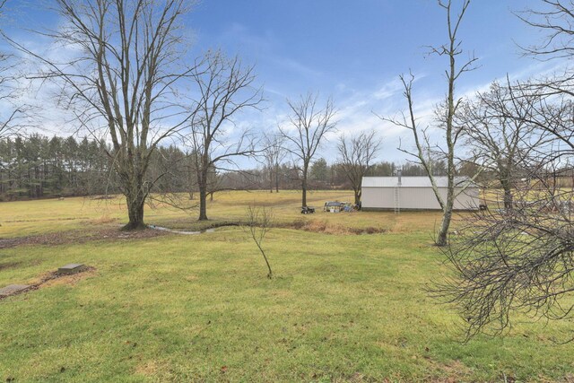 7760 Township Rd 177, Fredericktown, OH 43019 - view of grassy yard featuring an outbuilding and an outdoor structure