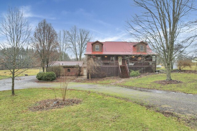 7760 Township Rd 177, Fredericktown, OH 43019 - view of front of home featuring a porch, stairs, curved driveway, a front yard, and metal roof