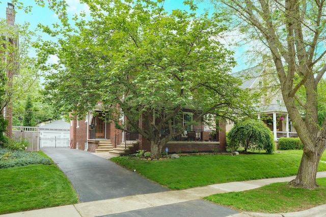 2454 Seneca Park Pl, Columbus, OH 43209 - obstructed view of property featuring brick siding and an outdoor structure